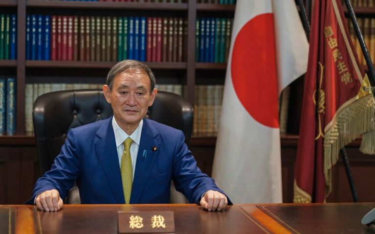 Support for Japan’s Suga falls after travel campaign reversal