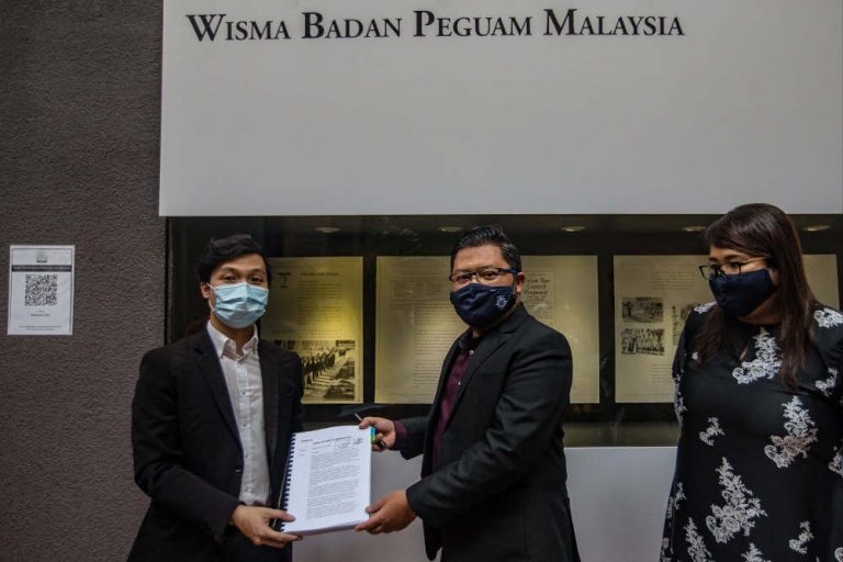 Outside Malaysian Bar HQ, seniors shine a torch on underpaid and overworked trainee lawyers