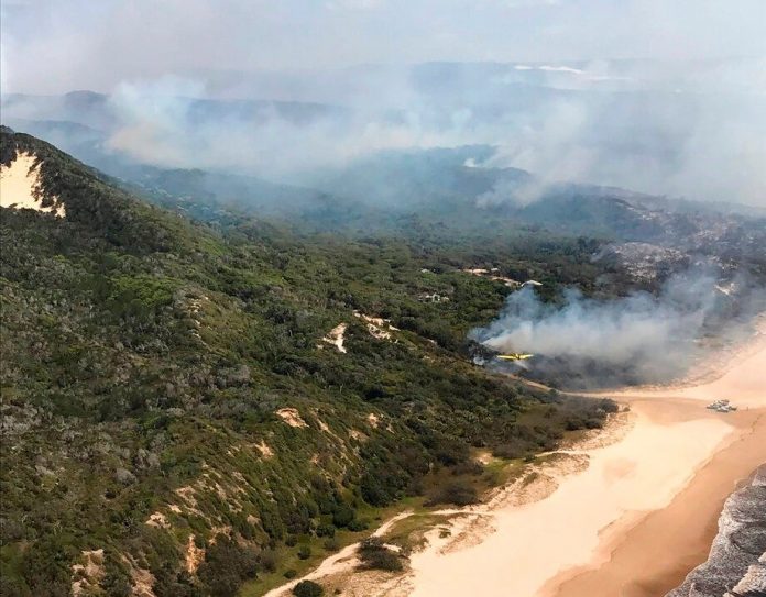 Rains dampen bushfire on Australia’s Fraser Island but danger not over