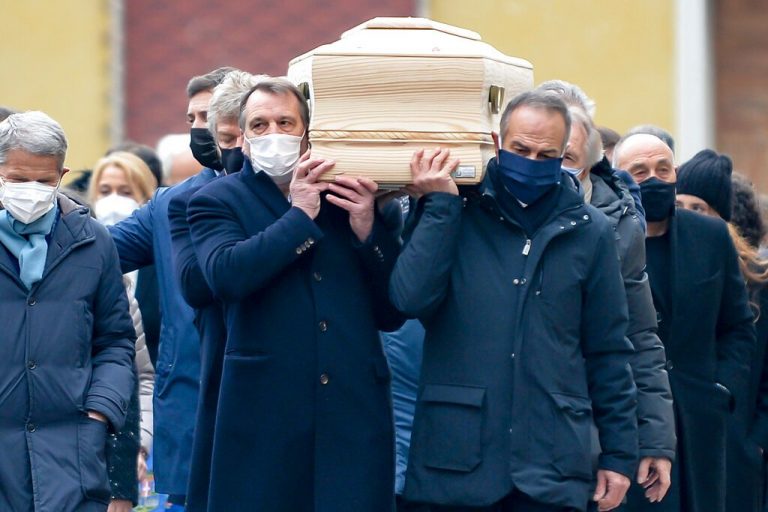 Thousands honour football great Rossi at funeral