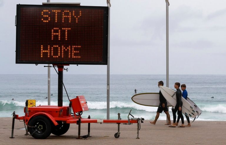 Australia holds off UK travel ban, bucking trend