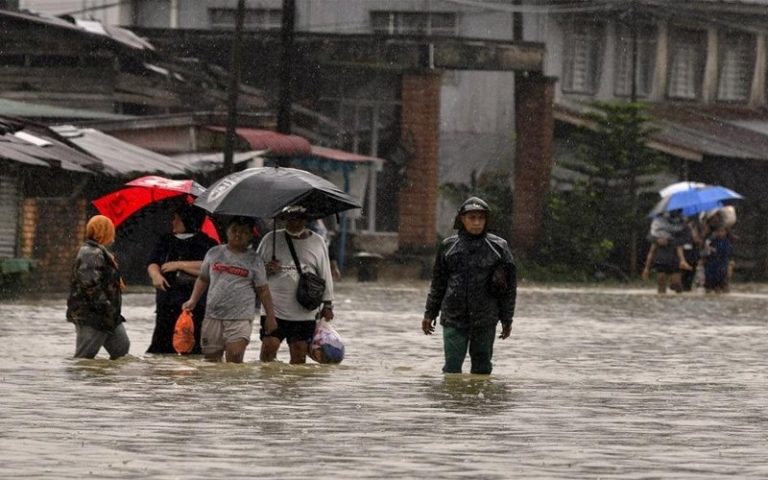 Flooded out, but old couple stay put with their goats and ducks