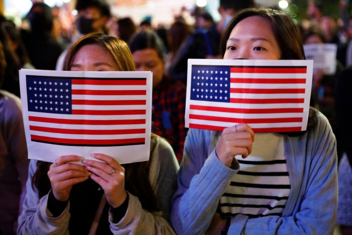 US targets more Chinese officials, moves to welcome Hong Kongers