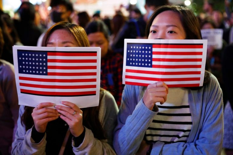 US targets more Chinese officials, moves to welcome Hong Kongers