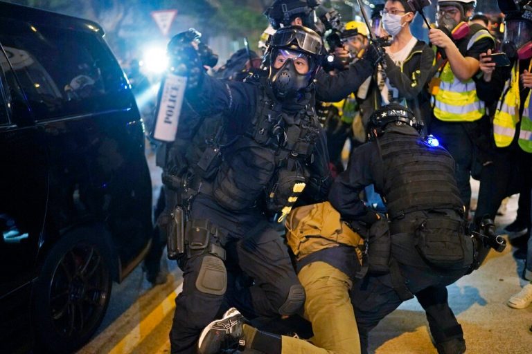 HK protester shot by cops last year skips court, goes into exile