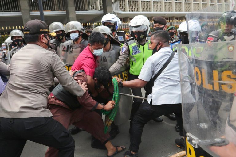 Hardline cleric’s supporters, cops clash in virus-hit Indonesia