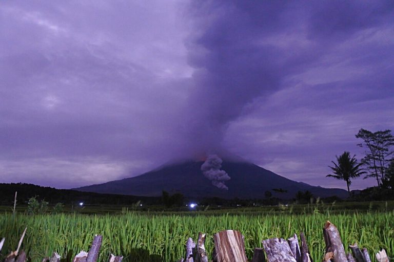 Hundreds flee as Indonesian volcano spews lava, ash
