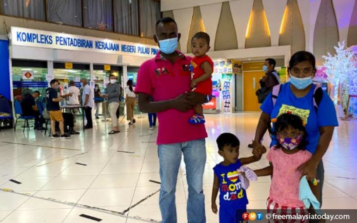 ‘Shoebox’ family in Penang gets government flat