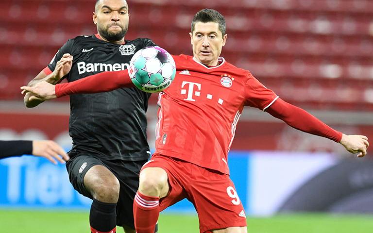 Lewandowski double fires Bayern top with Leverkusen win
