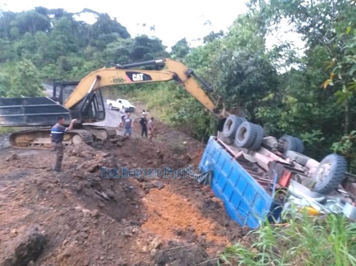 Lorry driver killed after vehicle overturns down slope