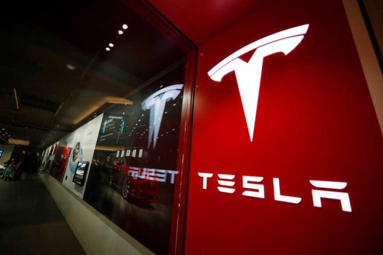Tesla tumbles 6.5% from record high in S&P 500 debut