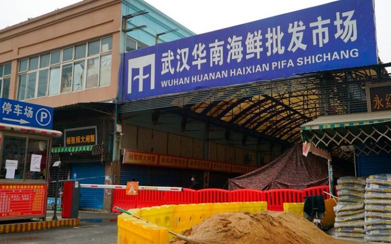 Wuhan market stays barricaded, empty a year after virus outbreak