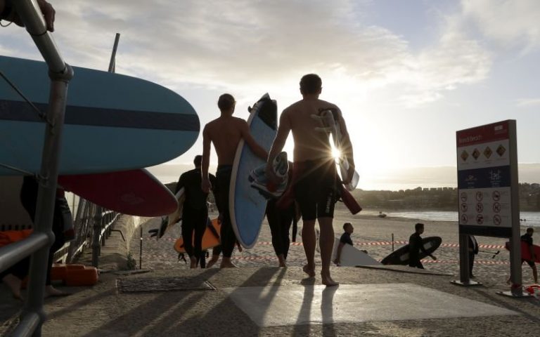 Rain, Covid-19 keep beachgoers away from Sydney’s Bondi Beach