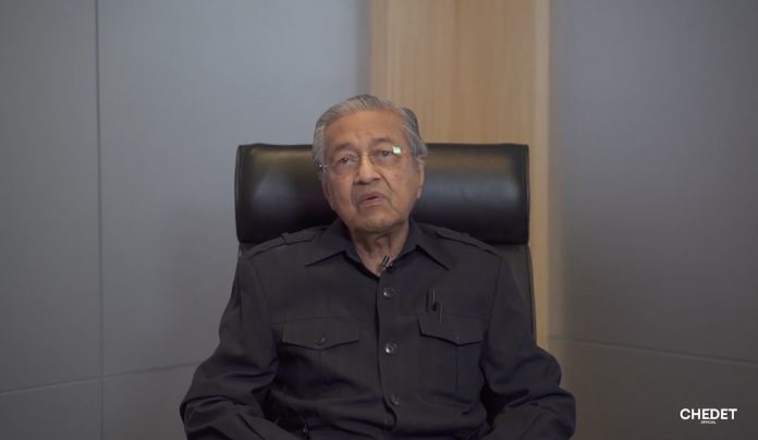 Listen to professionals instead of politicians if you really want to end Covid-19 crises, Dr M tells Muhyiddin