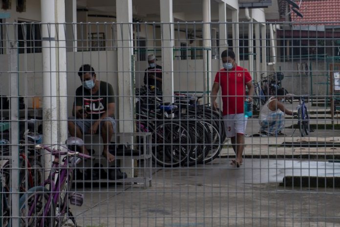 Senior minister hints at EO use to quickly make firms improve worker dorms