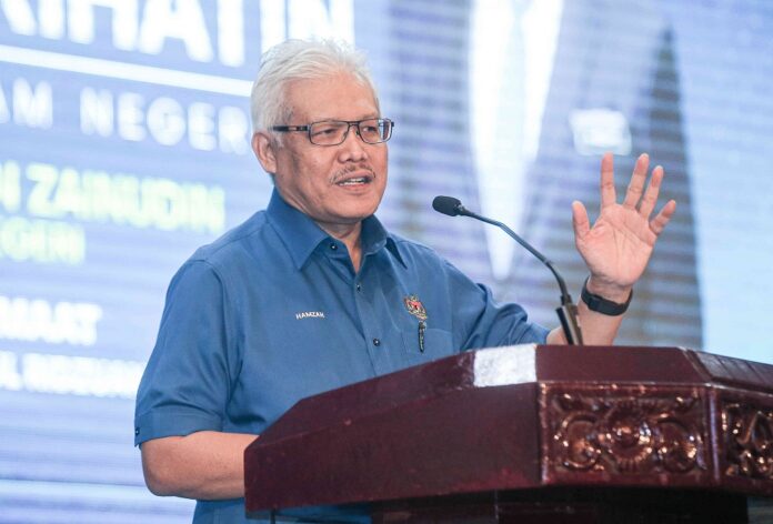 Home Minister: Police showed discretion over funeral procession arrest bearing secret society logo