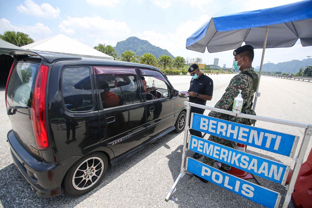 Roadblocks stepped up to foil unauthorised ‘balik kampung’ travellers