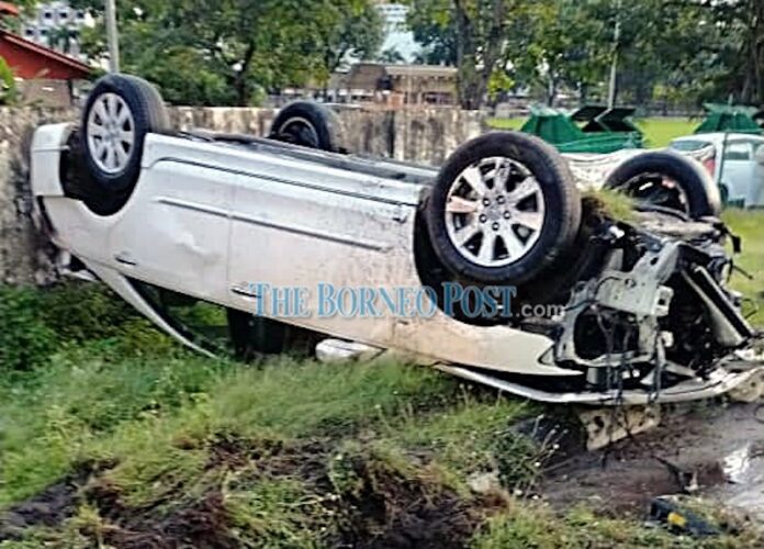 Woman in Miri cheats death after car turns turtle in accident