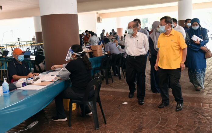 Sarawak agency says sorry, blames ‘unavoidable’ tech problem for blackout at Petra Jaya stadium during Covid-19 vaccination