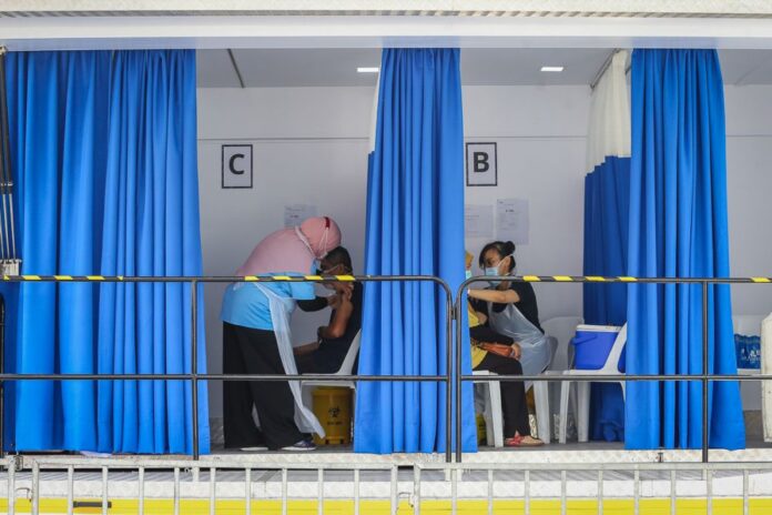 Health minister says almost 7.4 million Covid-19 vaccine doses administered as of Sunday