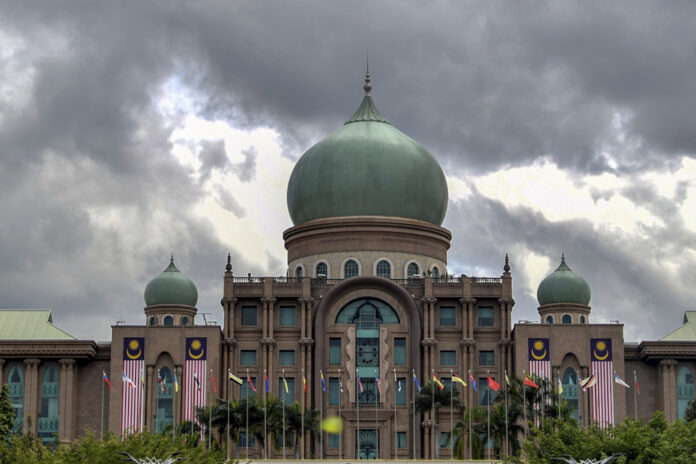Fitch unit predicts unity govt as power struggle continues, Khairy and Najib as ‘wildcard’ PM candidates