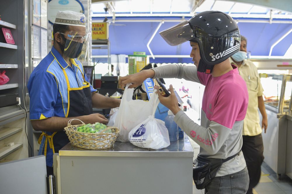 In the Klang Valley, food vendors say delivery platforms a boon not everyone can afford