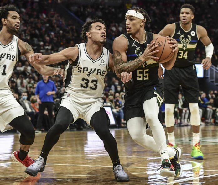 Spurs upset NBA champion Bucks, Wizards win in double OT