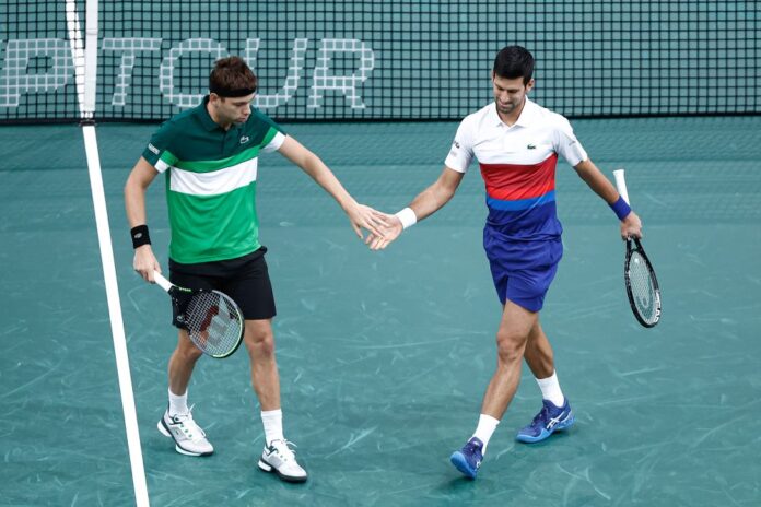 Djokovic makes winning return in Paris doubles