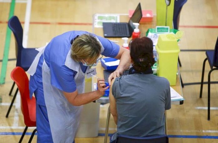 Oxford University says no evidence yet that vaccines won't protect against severe disease from Omicron