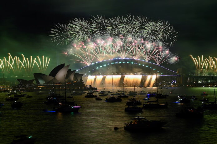 World rings in New Year under Covid cloud
