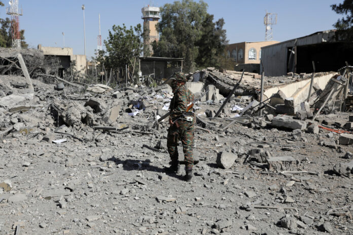 Saudi coalition says it strikes military camp in Sanaa, Houthis say bombs hit prison