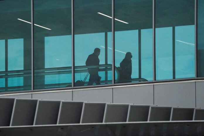 US travellers go ahead with travel despite Omicron wave, some flight cancellations