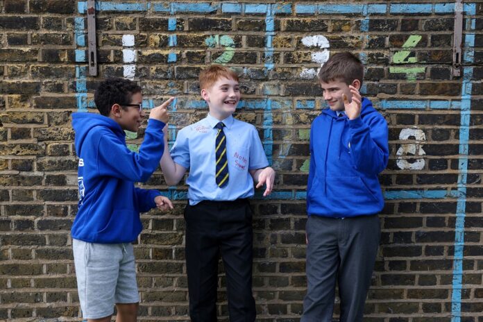 English school children to wear masks to tackle Omicron surge