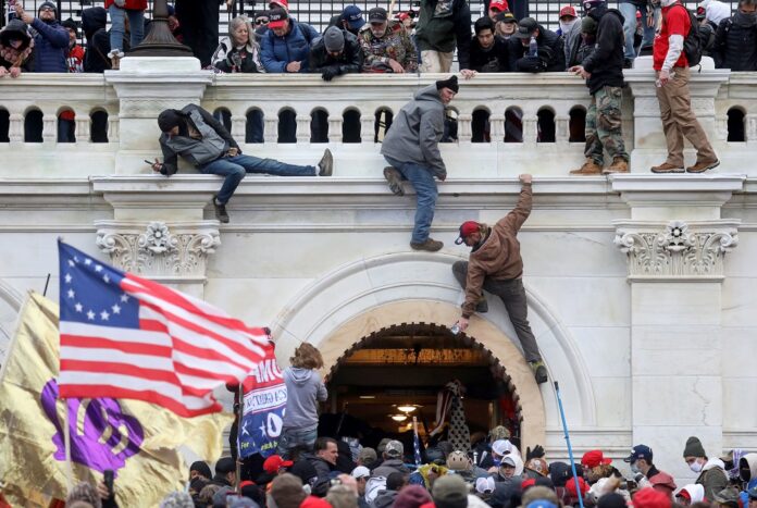 A year after Capitol siege, US democracy still faces test