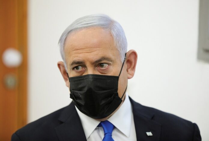 Israel's Netanyahu and Olmert face off in court in defamation case