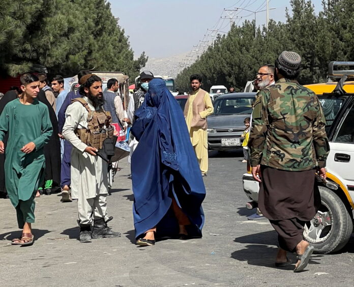 Taliban stage show of strength with parade after protests