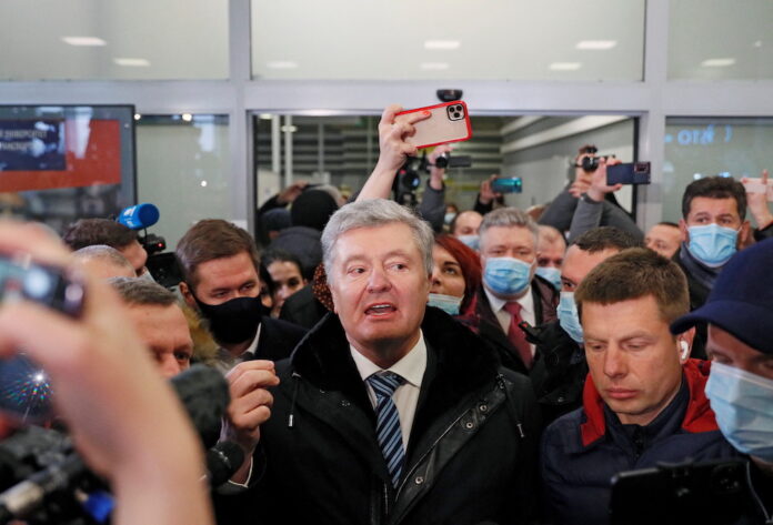 Former Ukraine president lands in Kyiv to face treason case