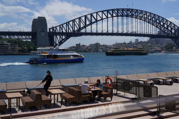 Australia to push ahead with reopening amid record Covid-19 cases