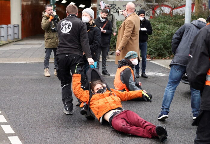Group of 11 climate activists glue themselves to Berlin motorway