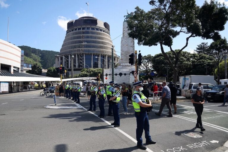 New Zealand virus cases spike as anti-vaccine protesters claim win