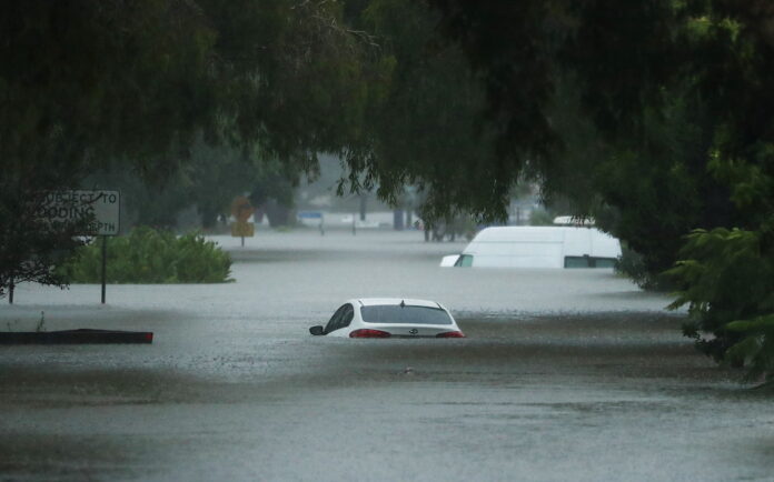 'Weather bomb' submerges Australian towns, strands people on roofs