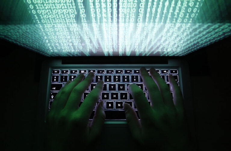 Ukraine hit by cyber attack as US questions Russian troop pullback