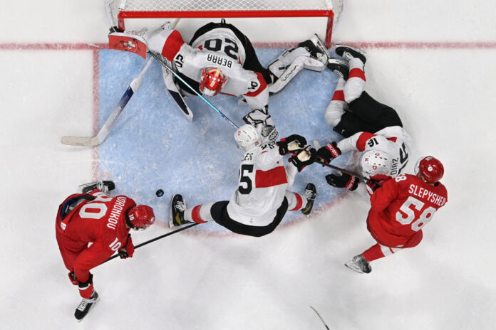 'Rusty' Russians begin defence of Olympic hockey crown with shaky win