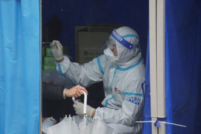 Virus-hit Hong Kong invokes emergency powers to allow in China medics