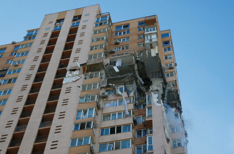 Officials: Kyiv apartment block hit by missile