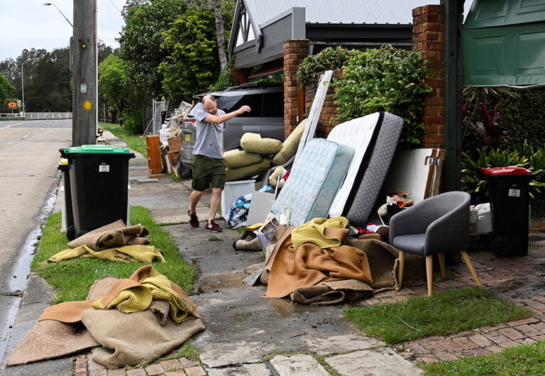 Thousands of Australians return to ‘uninhabitable’ homes as floods recede