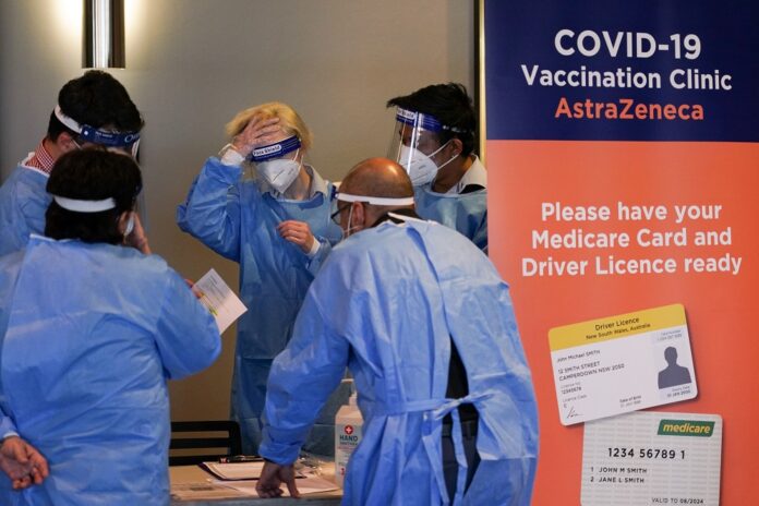 Australians told to get boosters amid Covid threat from new Omicron strain