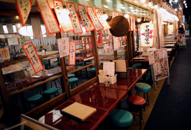 Japan ease border rules but extend virus curbs for some regions