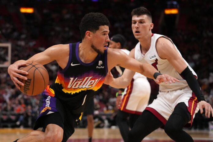 Booker stars as Suns beat Heat to seal NBA playoff berth