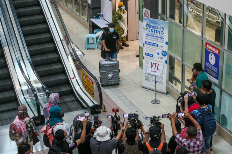 Johor polls: Hero’s welcome in Larkin for 5,000 postal votes fresh off VTL bus from Singapore